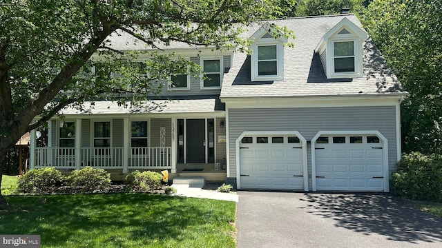 13757 Cabells Mill Dr, Centreville, VA 20120 - view of front of property with asphalt driveway, covered porch, roof with shingles, a chimney, and a front yard