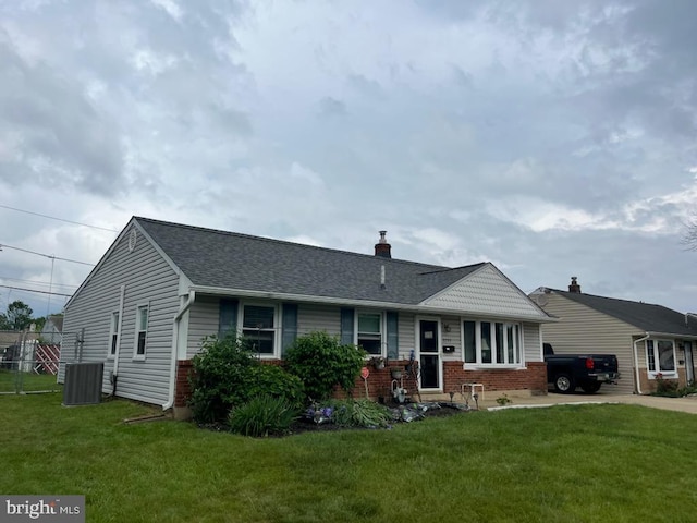 3755 Morrow Dr, Bensalem, PA 19020 - view of front of property featuring brick siding, cooling unit, a front yard, and a shingled roof