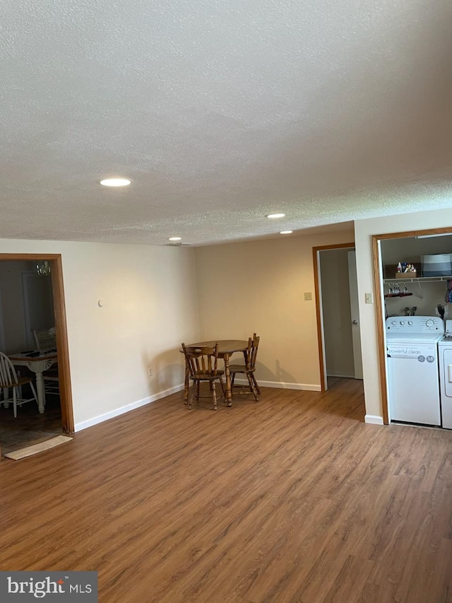 3755 Morrow Dr, Bensalem, PA 19020 - unfurnished dining area featuring a textured ceiling, wood finished floors, washing machine and dryer, baseboards, and recessed lighting