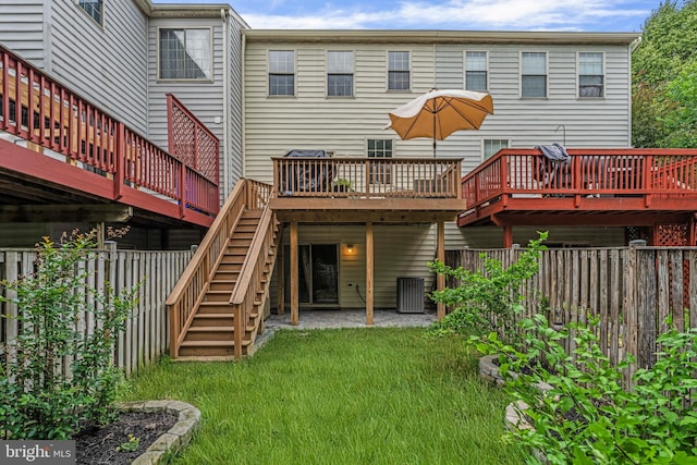 7250 Calm Sunset, Columbia, MD 21046 - back of property with a wooden deck, stairs, and cooling unit
