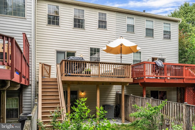 7250 Calm Sunset, Columbia, MD 21046 - back of property featuring stairs, central air condition unit, and a wooden deck