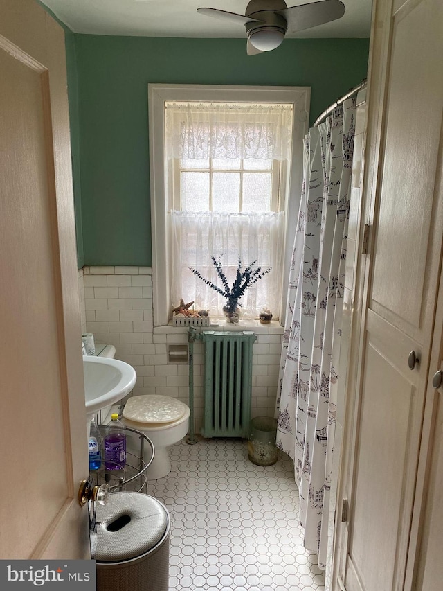 6136 Wayne Ave Unit 3, Philadelphia, PA 19144 - full bath featuring radiator heating unit, toilet, ceiling fan, wainscoting, and tile walls