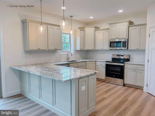 LOT32 Helens Dr, Greencastle, PA 17225 - kitchen featuring appliances with stainless steel finishes, a sink, a peninsula, light wood finished floors, and recessed lighting