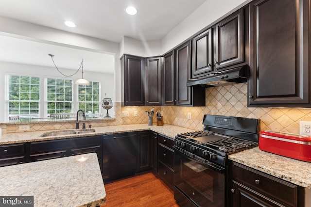 12752 Effie Rose Pl, Woodbridge, VA 22192 - kitchen featuring black appliances, a sink, under cabinet range hood, light stone countertops, and recessed lighting
