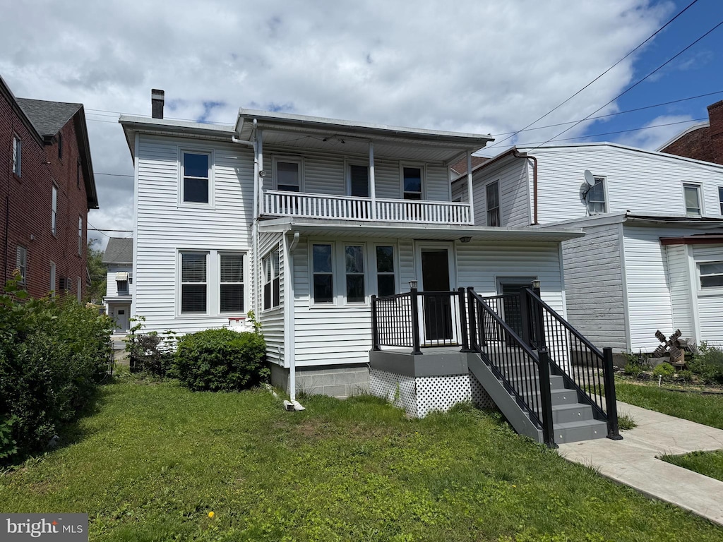 350 Main St, Denver, PA 17517 - view of front facade featuring a balcony and a front lawn