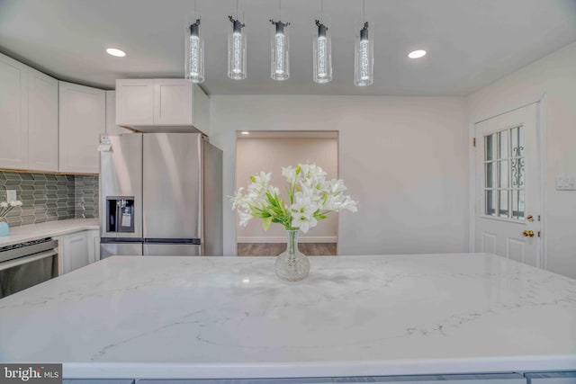 611 Parkview Blvd, Lansdowne, PA 19050 - kitchen featuring stainless steel fridge with ice dispenser, light stone countertops, white cabinets, backsplash, and recessed lighting