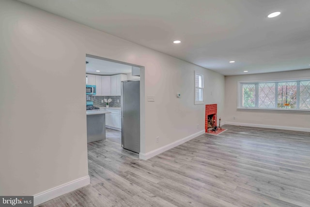 611 Parkview Blvd, Lansdowne, PA 19050 - unfurnished room with baseboards, light wood-style flooring, recessed lighting, and a fireplace