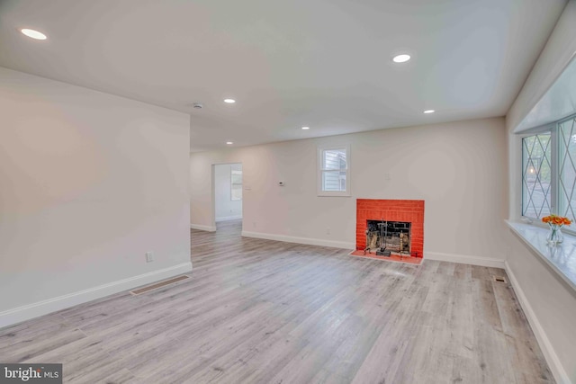 611 Parkview Blvd, Lansdowne, PA 19050 - unfurnished living room featuring a brick fireplace, healthy amount of natural light, wood finished floors, baseboards, and recessed lighting