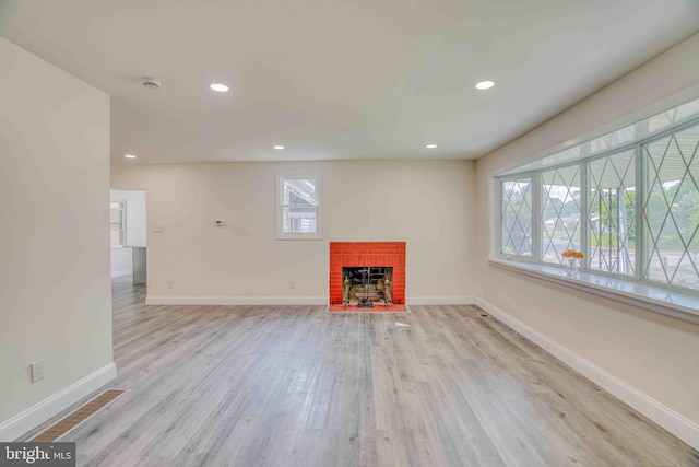611 Parkview Blvd, Lansdowne, PA 19050 - unfurnished living room with a brick fireplace, light wood-style floors, baseboards, and recessed lighting