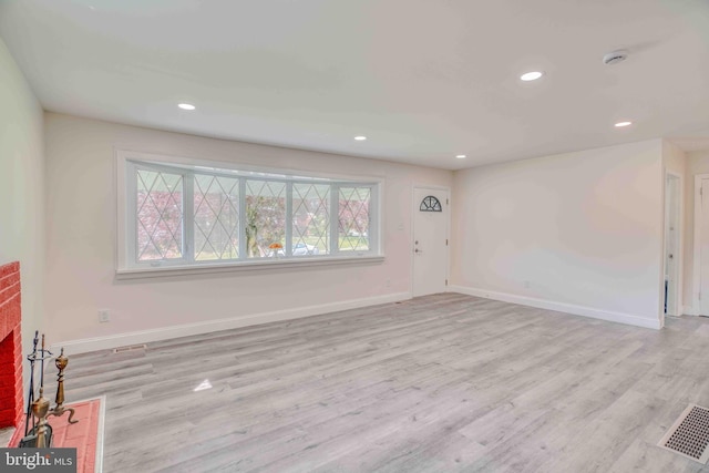 611 Parkview Blvd, Lansdowne, PA 19050 - unfurnished living room featuring light wood-type flooring, recessed lighting, baseboards, and a brick fireplace