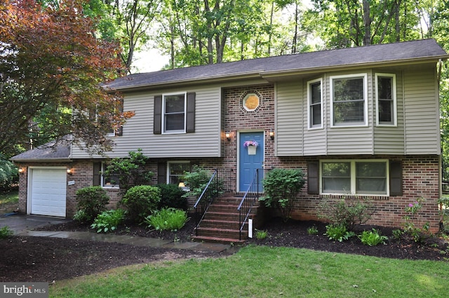 12502 Quarter Charge Dr, Spotsylvania, VA 22551 - bi-level home with brick siding, a garage, and a front lawn