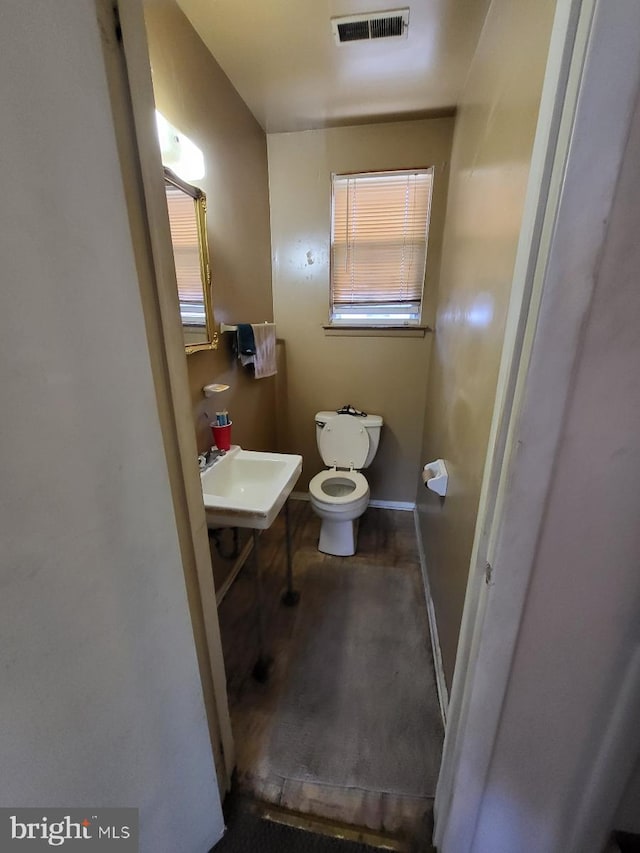 6 Florence Tollgate, Florence, NJ 08518 - bathroom with toilet, a sink, and baseboards