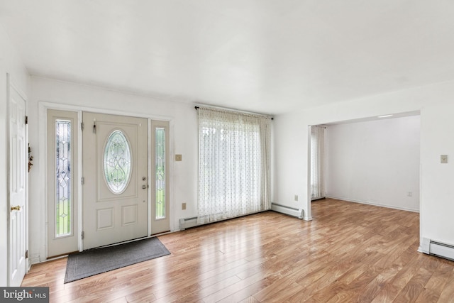 3 Karok Ln, Browns Mills, NJ 08015 - foyer entrance with plenty of natural light, a baseboard radiator, and light wood-style flooring