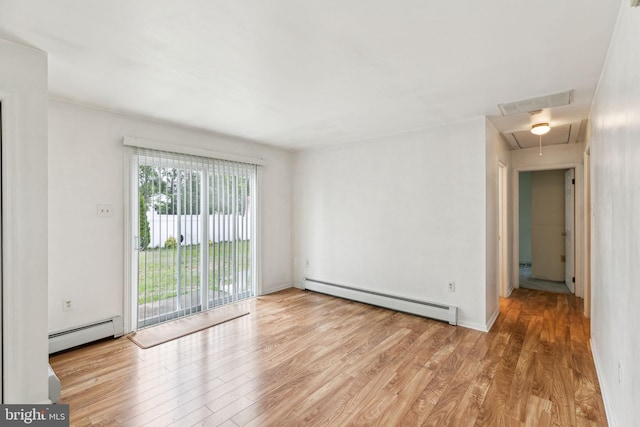 3 Karok Ln, Browns Mills, NJ 08015 - spare room with a baseboard heating unit, attic access, and wood finished floors