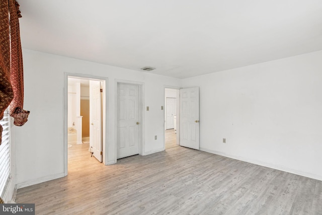 3 Karok Ln, Browns Mills, NJ 08015 - unfurnished bedroom featuring light wood-style floors, baseboards, and ensuite bathroom
