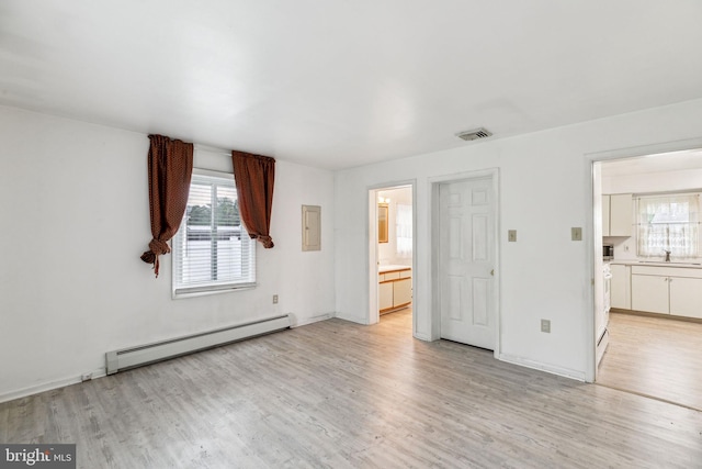 3 Karok Ln, Browns Mills, NJ 08015 - unfurnished bedroom with a baseboard radiator, light wood-style floors, a sink, ensuite bathroom, and electric panel
