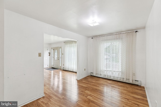 3 Karok Ln, Browns Mills, NJ 08015 - empty room featuring a baseboard radiator, wood finished floors, and baseboards