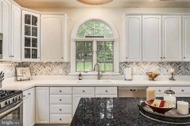 1597 Woodfield Dr, Bethlehem, PA 18015 - kitchen featuring a sink, appliances with stainless steel finishes, white cabinetry, and glass insert cabinets
