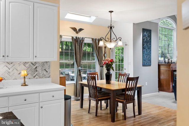 1597 Woodfield Dr, Bethlehem, PA 18015 - dining area with a skylight, baseboards, and light wood-type flooring