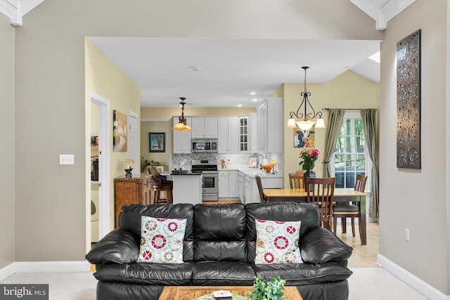 1597 Woodfield Dr, Bethlehem, PA 18015 - living room featuring baseboards, light carpet, crown molding, recessed lighting, and lofted ceiling