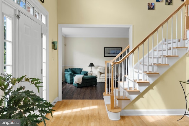 1597 Woodfield Dr, Bethlehem, PA 18015 - entryway with stairs, wood finished floors, and baseboards