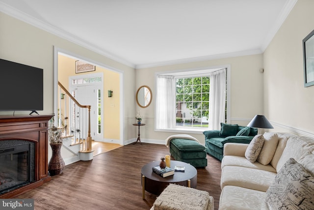 1597 Woodfield Dr, Bethlehem, PA 18015 - living area with ornamental molding, wood finished floors, stairway, baseboards, and a glass covered fireplace