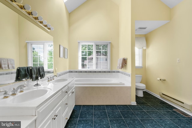 1597 Woodfield Dr, Bethlehem, PA 18015 - bathroom with a baseboard heating unit, toilet, a garden tub, tile patterned flooring, and double vanity