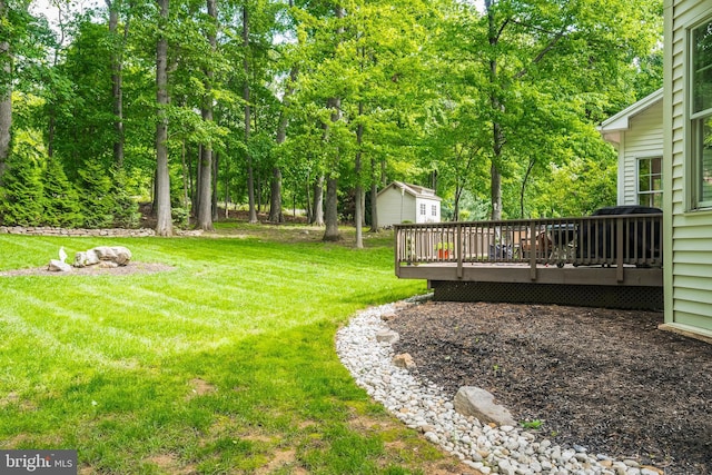 1597 Woodfield Dr, Bethlehem, PA 18015 - view of grassy yard featuring a wooden deck, an outbuilding, and view of scattered trees