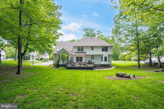 1597 Woodfield Dr, Bethlehem, PA 18015 - back of property featuring a lawn and a deck