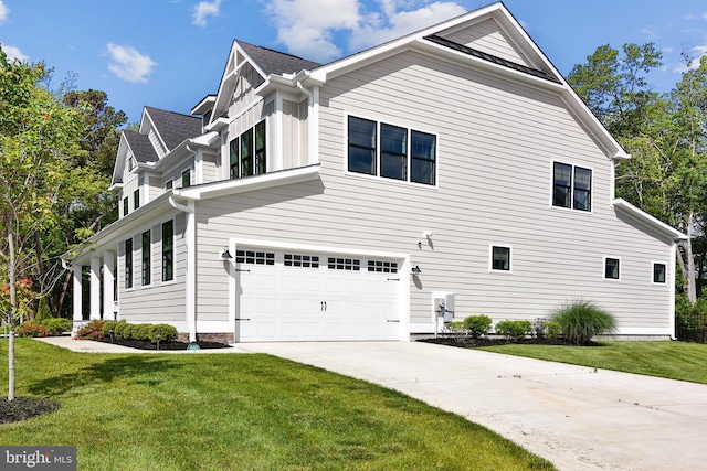 24153 Heartleaf Rd, Frankford, DE 19945 - view of property exterior featuring a garage, driveway, and a lawn