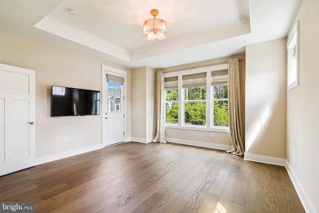 24153 Heartleaf Rd, Frankford, DE 19945 - unfurnished living room with a raised ceiling, hardwood / wood-style flooring, ornamental molding, and baseboards