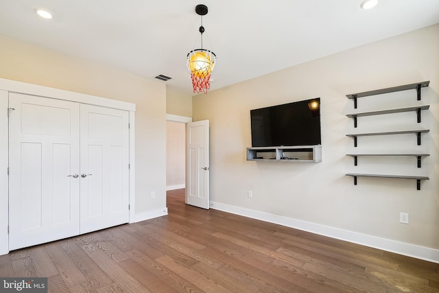 24153 Heartleaf Rd, Frankford, DE 19945 - unfurnished bedroom with wood finished floors, baseboards, recessed lighting, and a closet