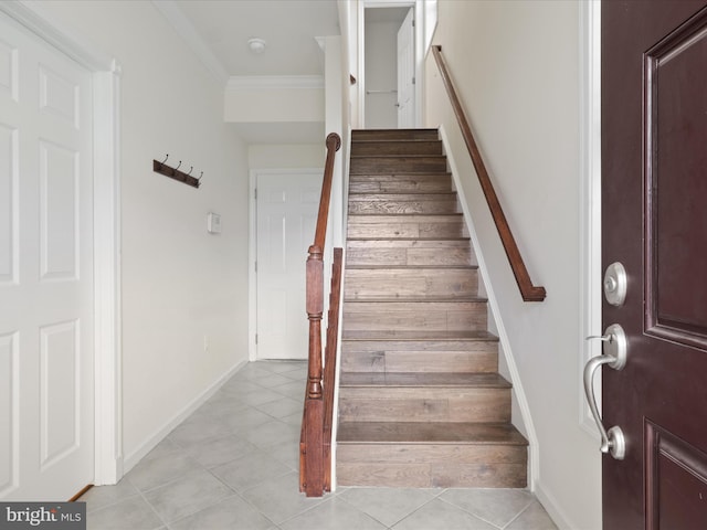 43167 Loudoun Reserve Dr, Ashburn, VA 20148 - stairs featuring tile patterned flooring, ornamental molding, and baseboards
