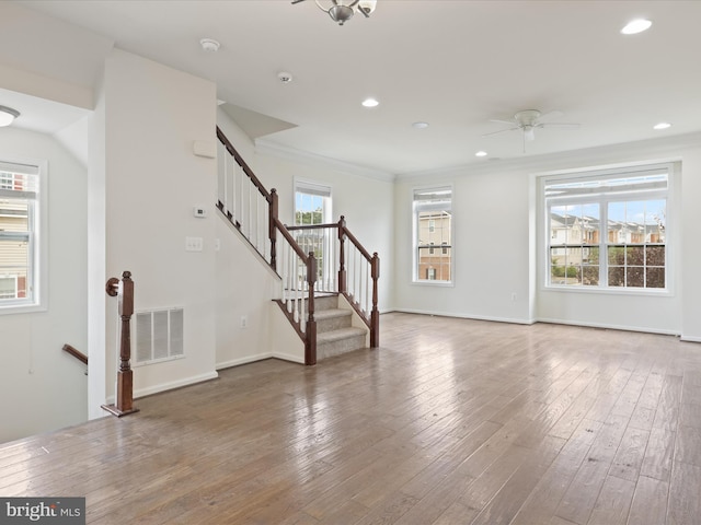 43167 Loudoun Reserve Dr, Ashburn, VA 20148 - unfurnished living room with a ceiling fan, wood-type flooring, recessed lighting, baseboards, and crown molding