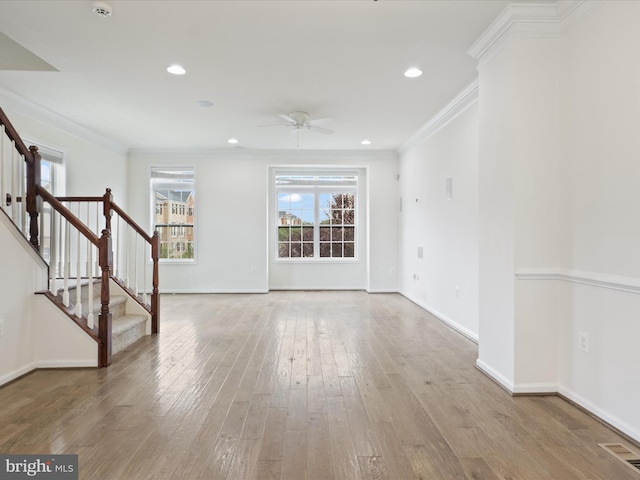 43167 Loudoun Reserve Dr, Ashburn, VA 20148 - unfurnished living room with a ceiling fan, stairway, crown molding, wood-type flooring, and baseboards