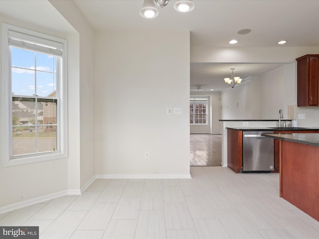 43167 Loudoun Reserve Dr, Ashburn, VA 20148 - kitchen featuring a chandelier, dishwasher, dark countertops, baseboards, and a sink