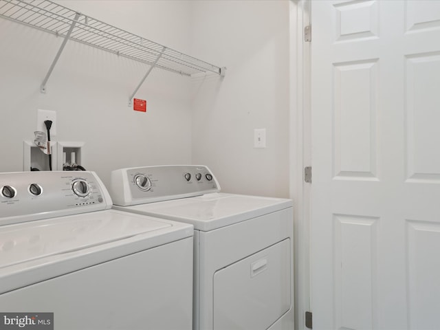 43167 Loudoun Reserve Dr, Ashburn, VA 20148 - washroom featuring washer and clothes dryer