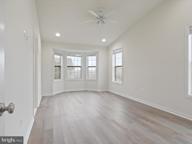 43167 Loudoun Reserve Dr, Ashburn, VA 20148 - spare room with wood finished floors, ceiling fan, recessed lighting, baseboards, and lofted ceiling