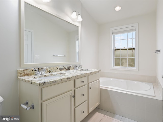 43167 Loudoun Reserve Dr, Ashburn, VA 20148 - bathroom featuring a garden tub, double vanity, and tile patterned flooring