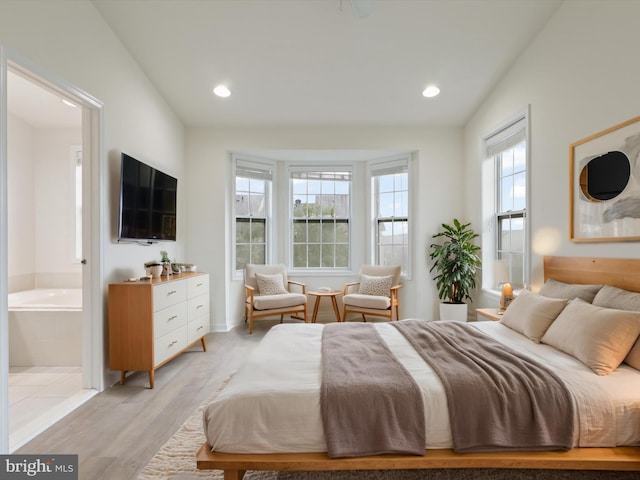 43167 Loudoun Reserve Dr, Ashburn, VA 20148 - bedroom featuring light wood-type flooring, ensuite bath, and recessed lighting