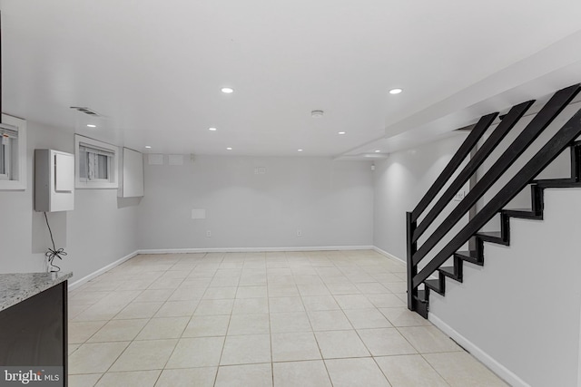 2802 Bruce Pl SE, Washington, DC 20020 - finished basement with recessed lighting, baseboards, light tile patterned floors, and stairway