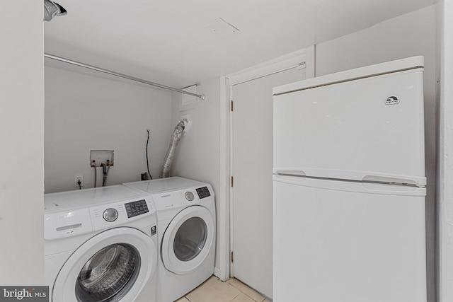 2802 Bruce Pl SE, Washington, DC 20020 - washroom with independent washer and dryer and light tile patterned floors