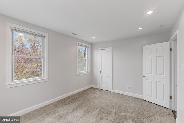 2802 Bruce Pl SE, Washington, DC 20020 - unfurnished bedroom featuring carpet, baseboards, recessed lighting, and a closet