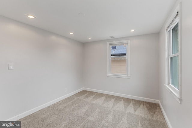 2802 Bruce Pl SE, Washington, DC 20020 - carpeted empty room with baseboards, recessed lighting, and plenty of natural light