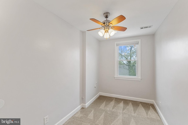 2802 Bruce Pl SE, Washington, DC 20020 - empty room with ceiling fan, baseboards, and light carpet