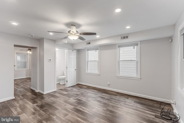 2802 Bruce Pl SE, Washington, DC 20020 - unfurnished bedroom with dark wood finished floors, baseboards, recessed lighting, and connected bathroom