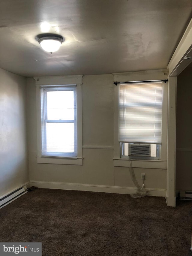 2523 Garrett Ave, Baltimore, MD 21218 - empty room with dark carpet and a baseboard radiator