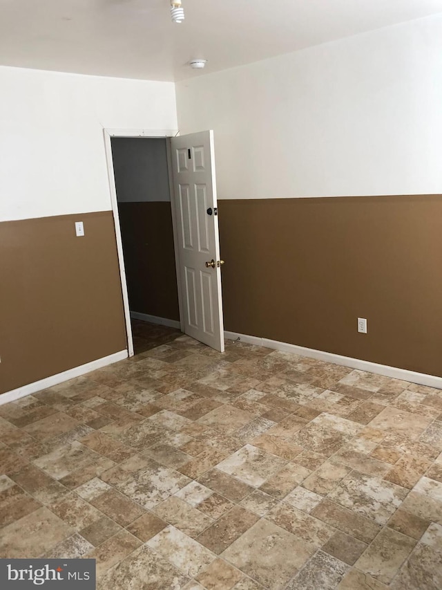 2523 Garrett Ave, Baltimore, MD 21218 - spare room with stone finish flooring and baseboards