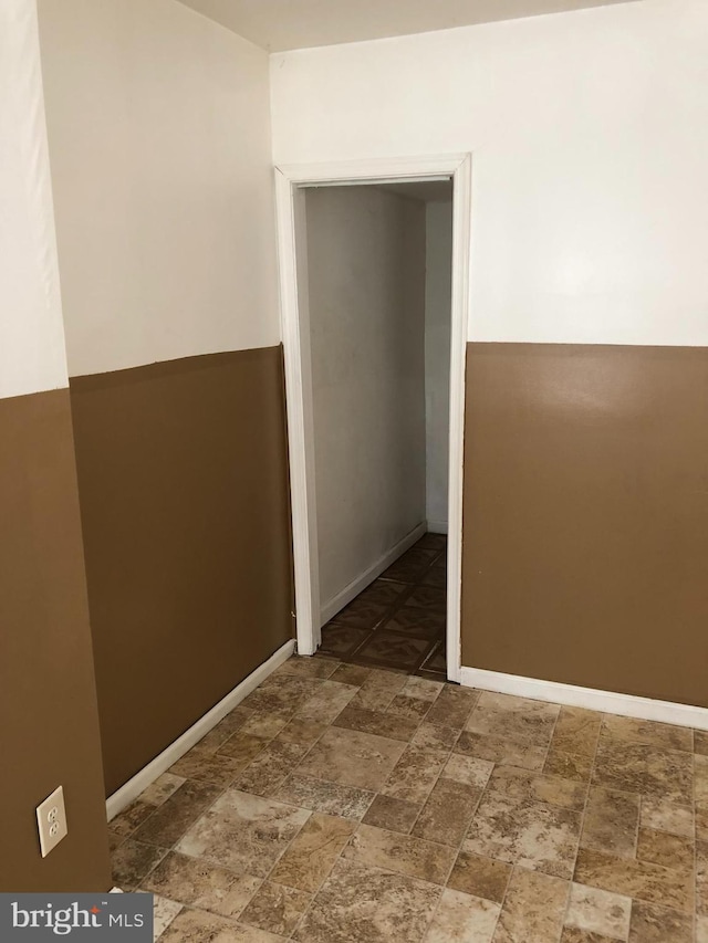 2523 Garrett Ave, Baltimore, MD 21218 - unfurnished room with stone finish flooring and baseboards