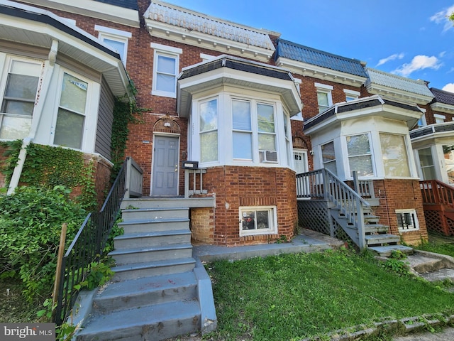 2523 Garrett Ave, Baltimore, MD 21218 - view of front facade featuring brick siding, stairs, and cooling unit